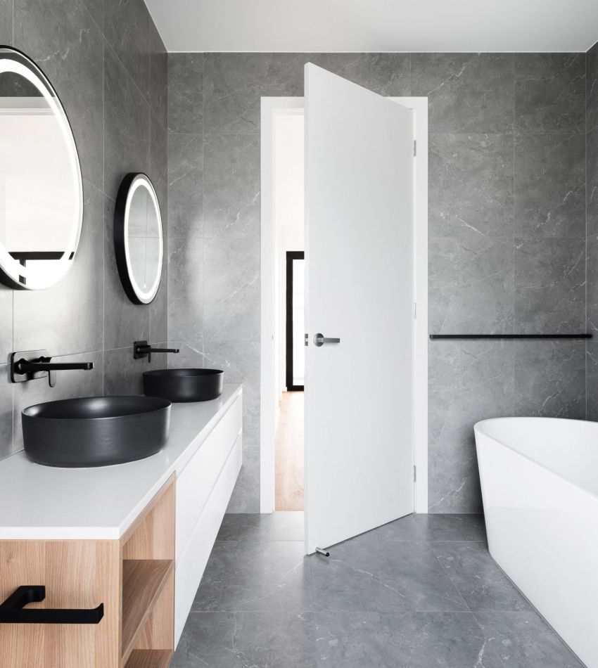 grey bathroom photo with soaking tub